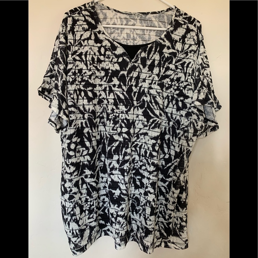 Flowered knit top. Open neck with peek of built-in tank Size XL